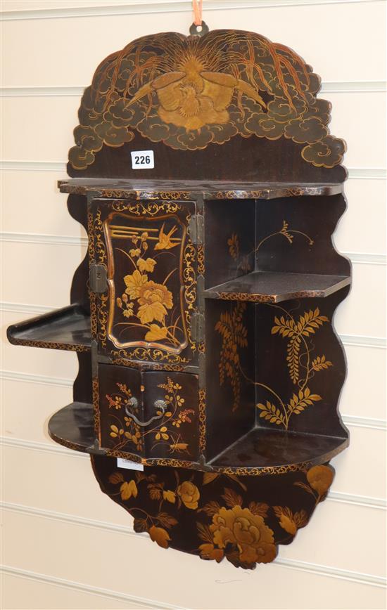 A Japanese gilt lacquered hanging wall shelves length 69cm